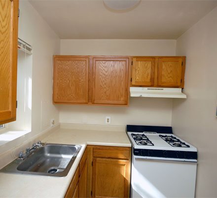 a kitchen with a stove and a sink